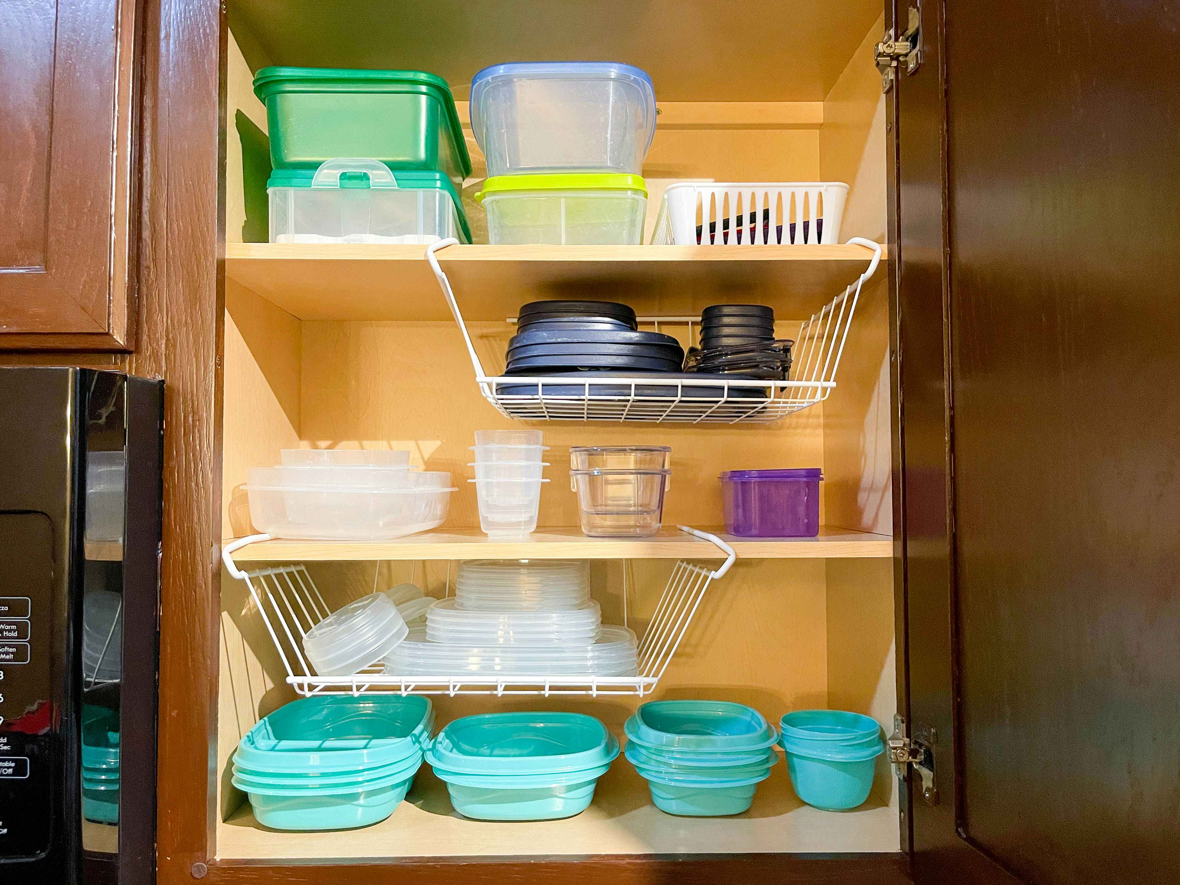 tupperware organized in cabinet