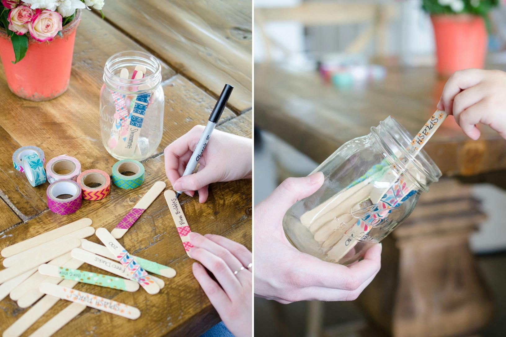 Someone writing ideas on popsicle sticks then placing them in a jar.