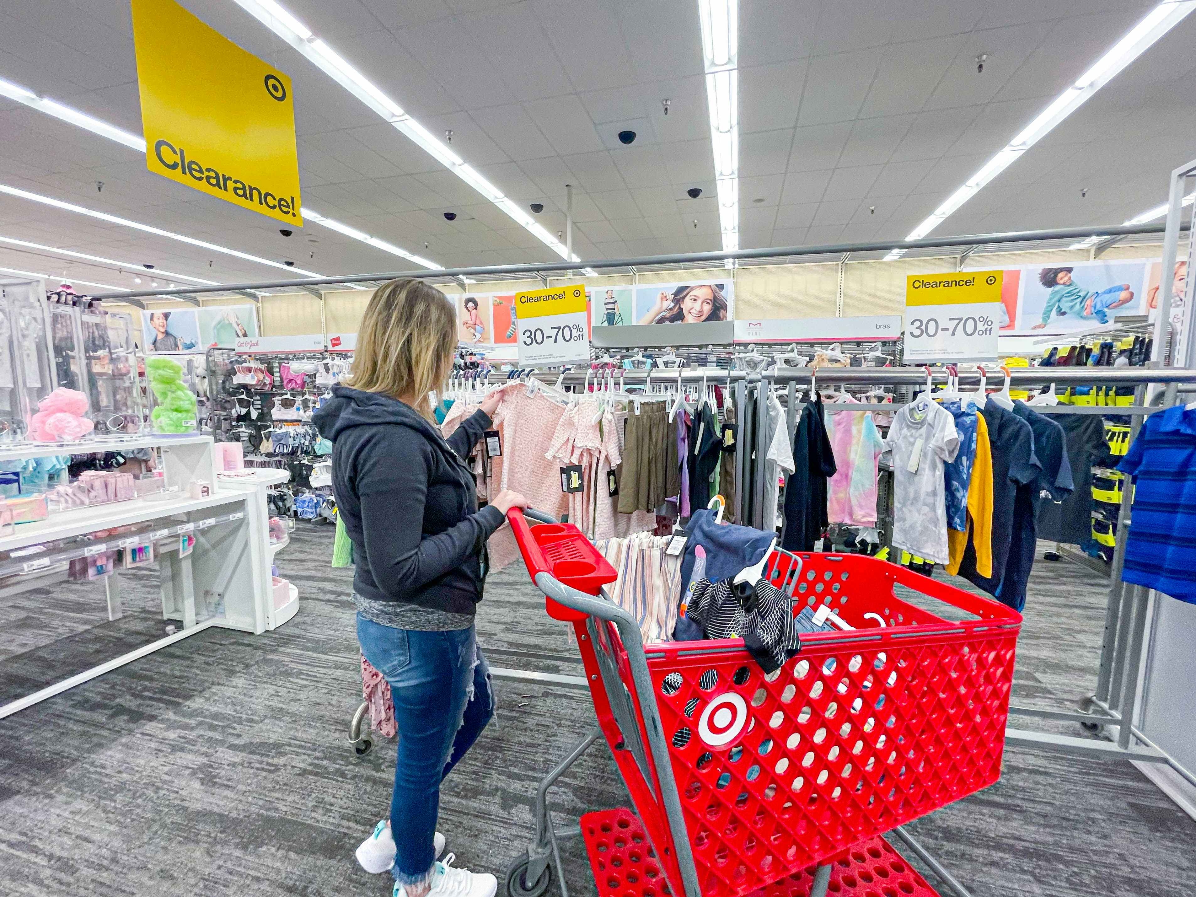 woman shopping in kids clearance area