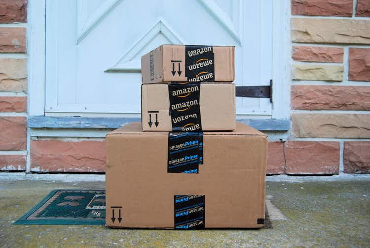 Three Amazon Prime boxes stacked on a front doorstep.