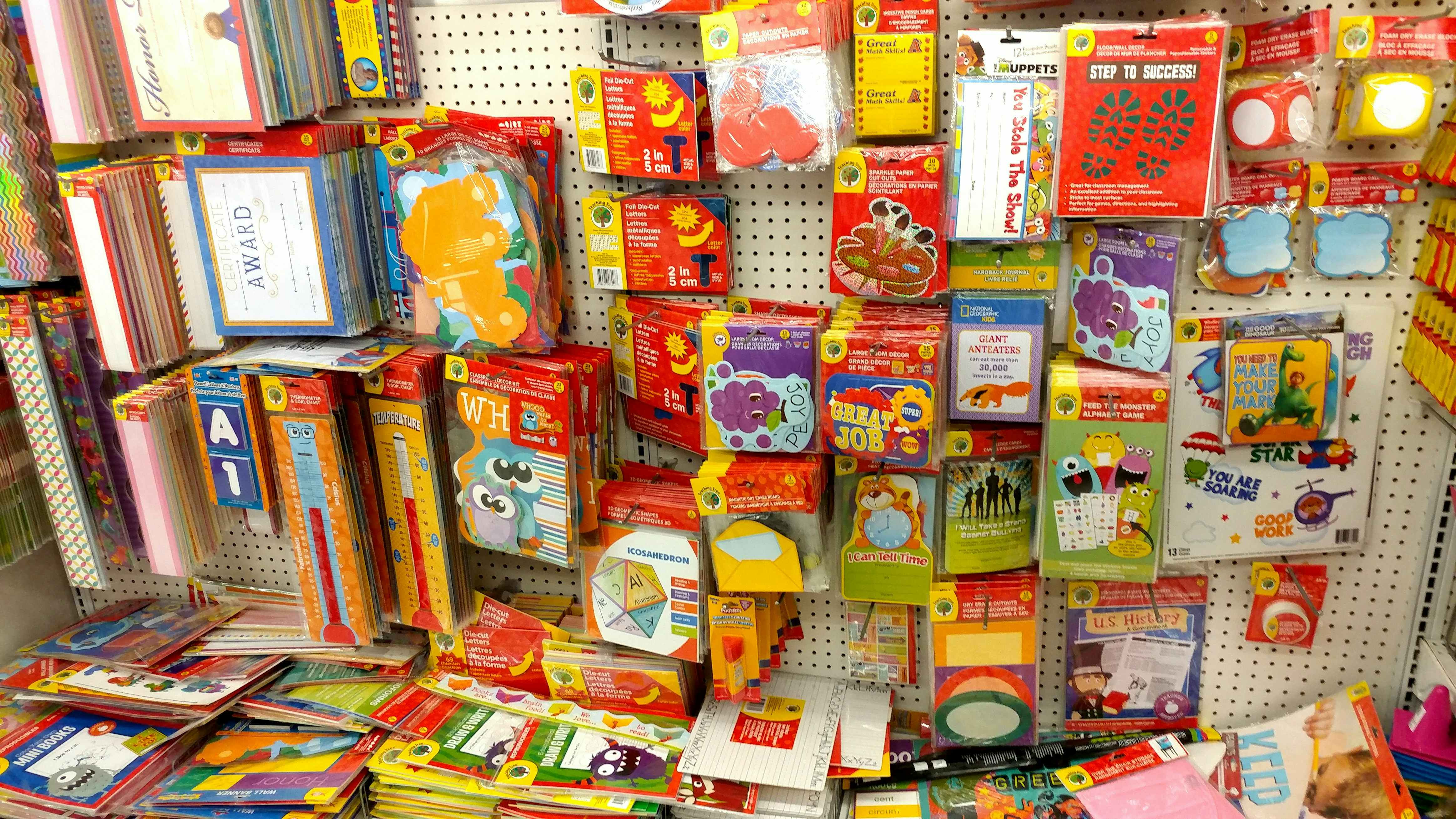 A display of classroom decor and teacher supplies for sale at Dollar Tree.