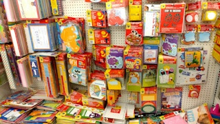 A display of classroom decor and teacher supplies for sale at Dollar Tree.