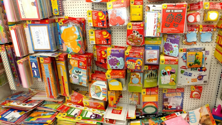A display of classroom decor and teacher supplies for sale at Dollar Tree.
