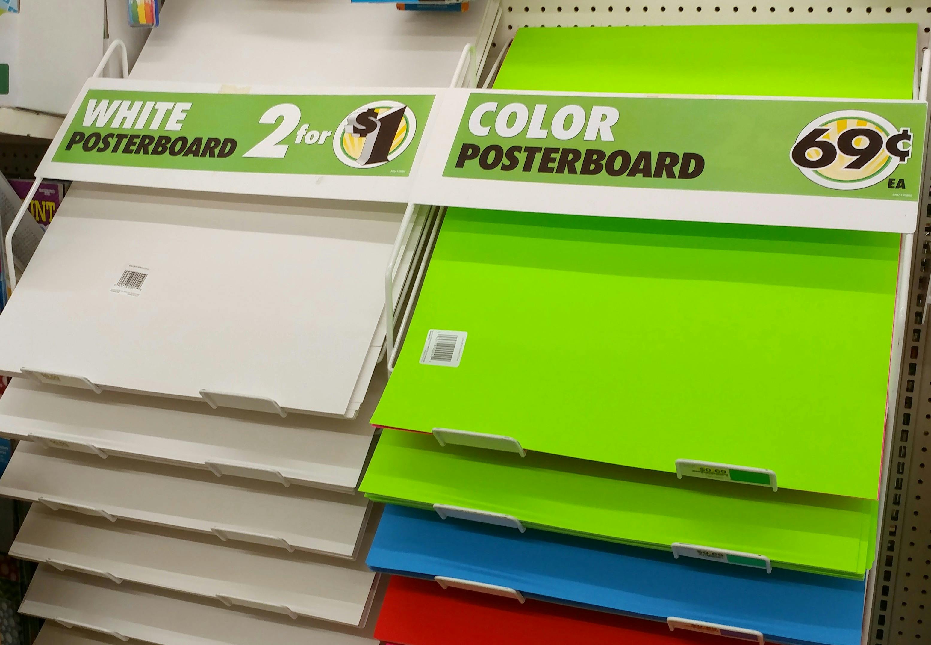 A display of white and colorful poster boards at Dollar Tree. 