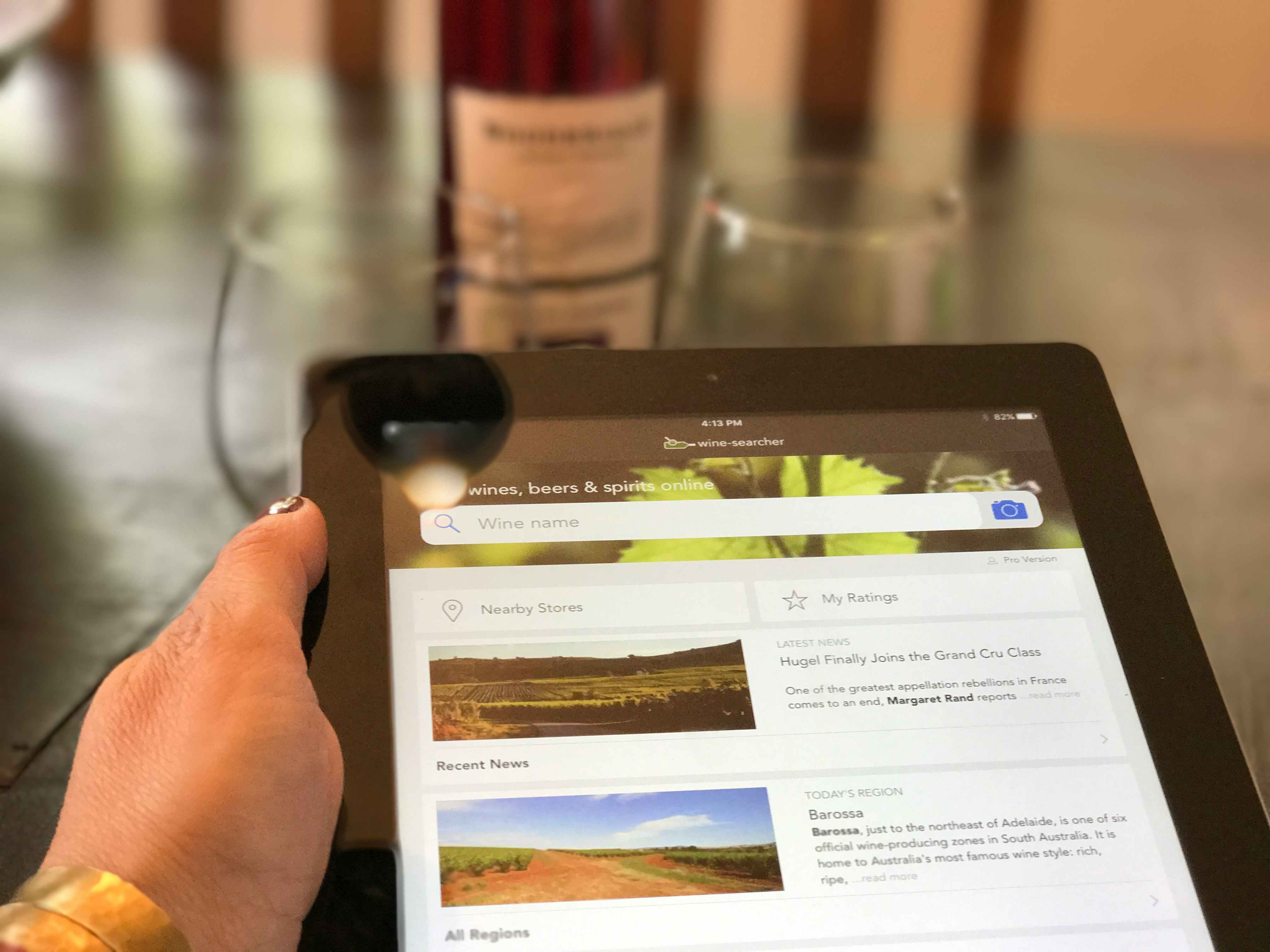a person searching for wine on their ipad