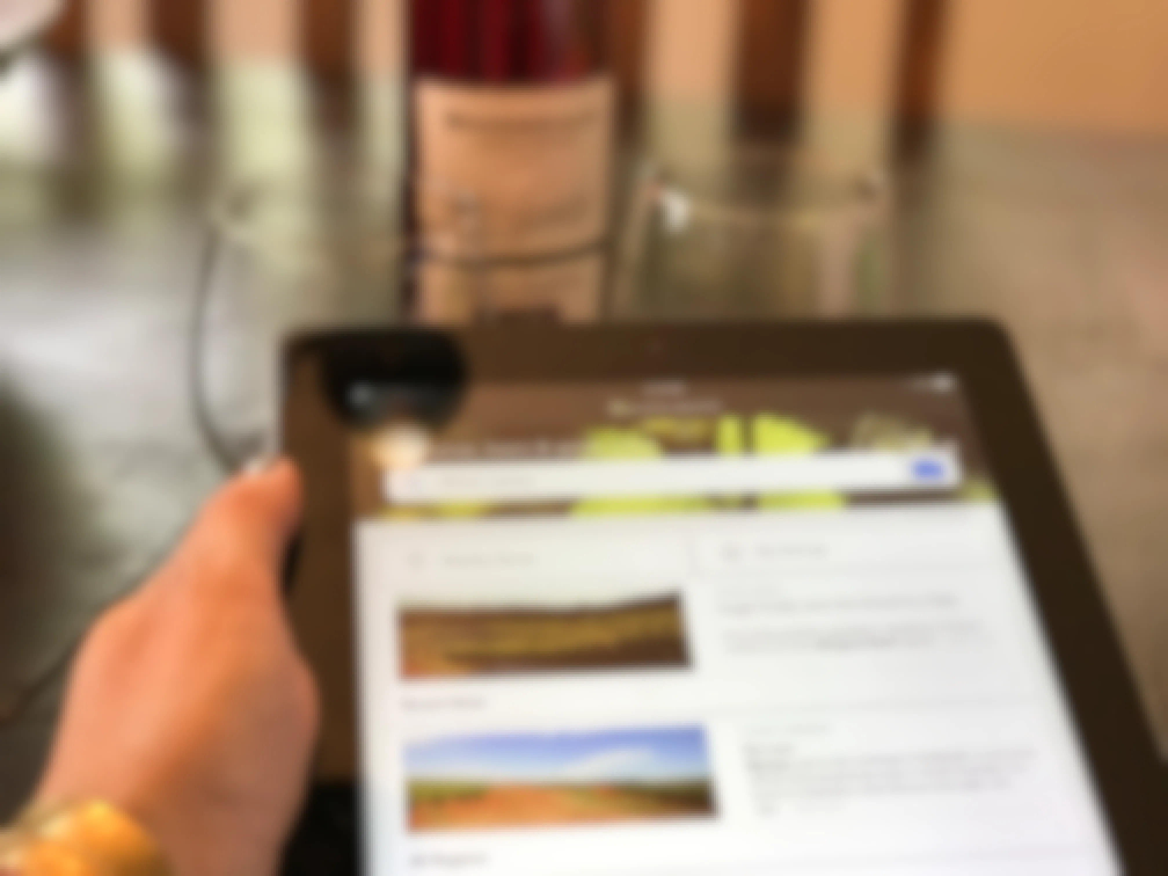 a person searching for wine on their ipad