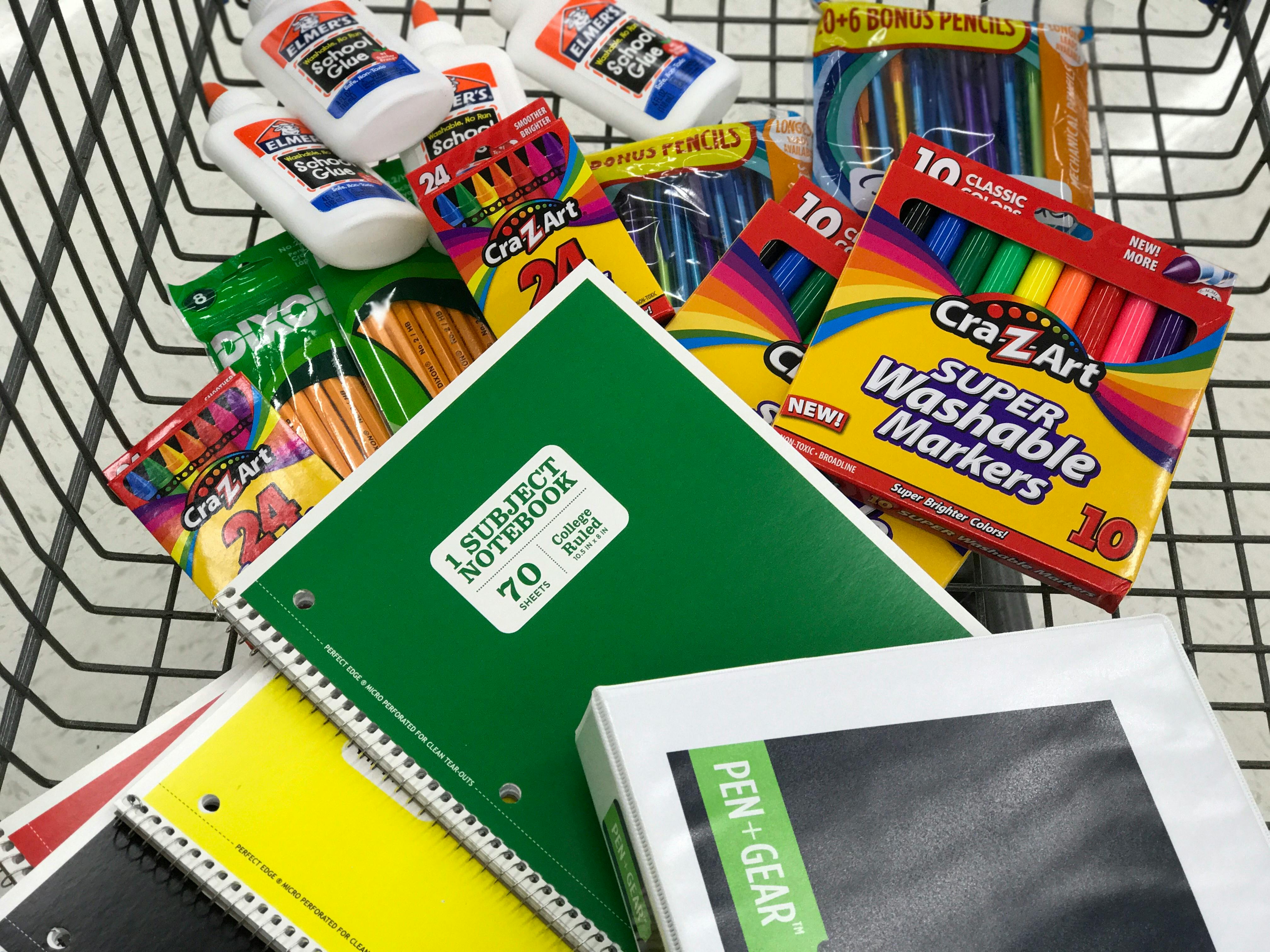 School supplies in a shopping basket. 