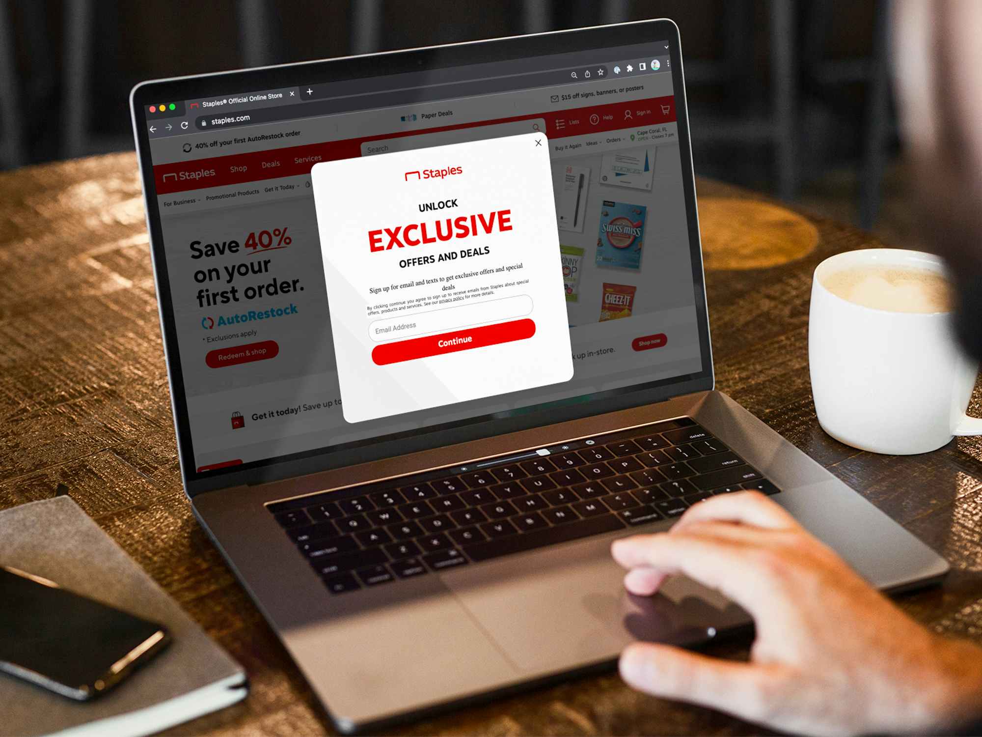 Someone signing up for email offers on Staples.com