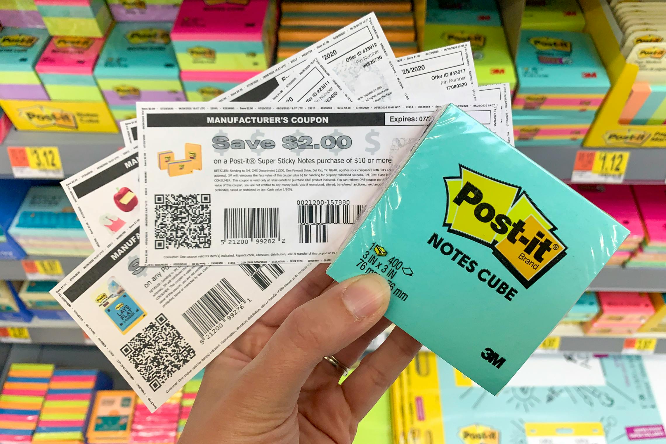 A pack of post-its held along with coupons