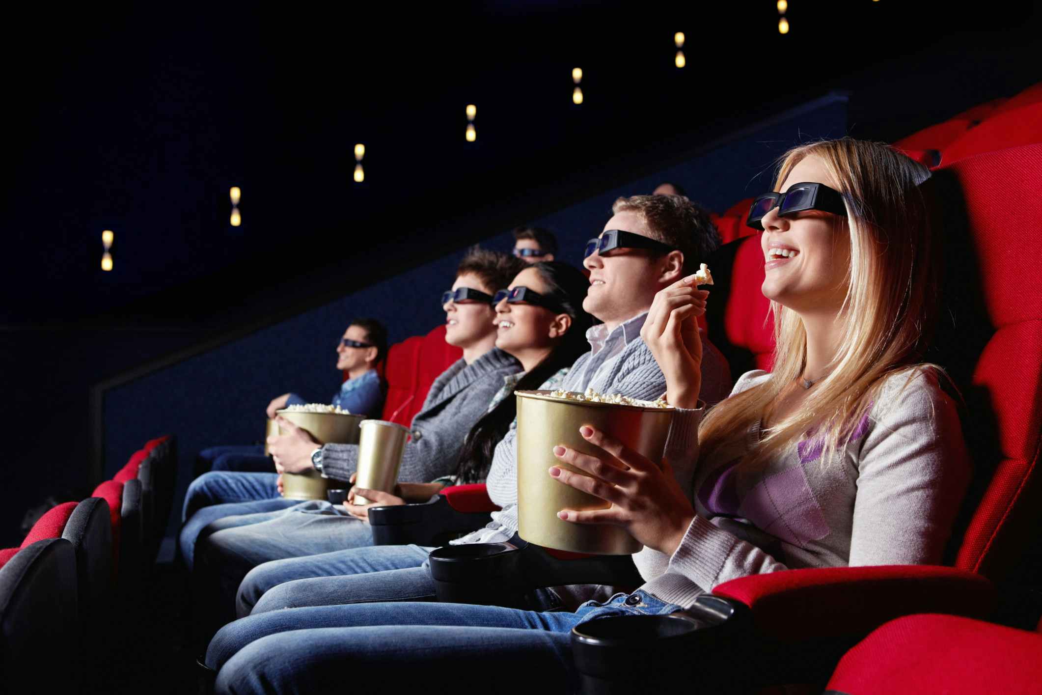 Family enjoying a movie with 3D glasses on