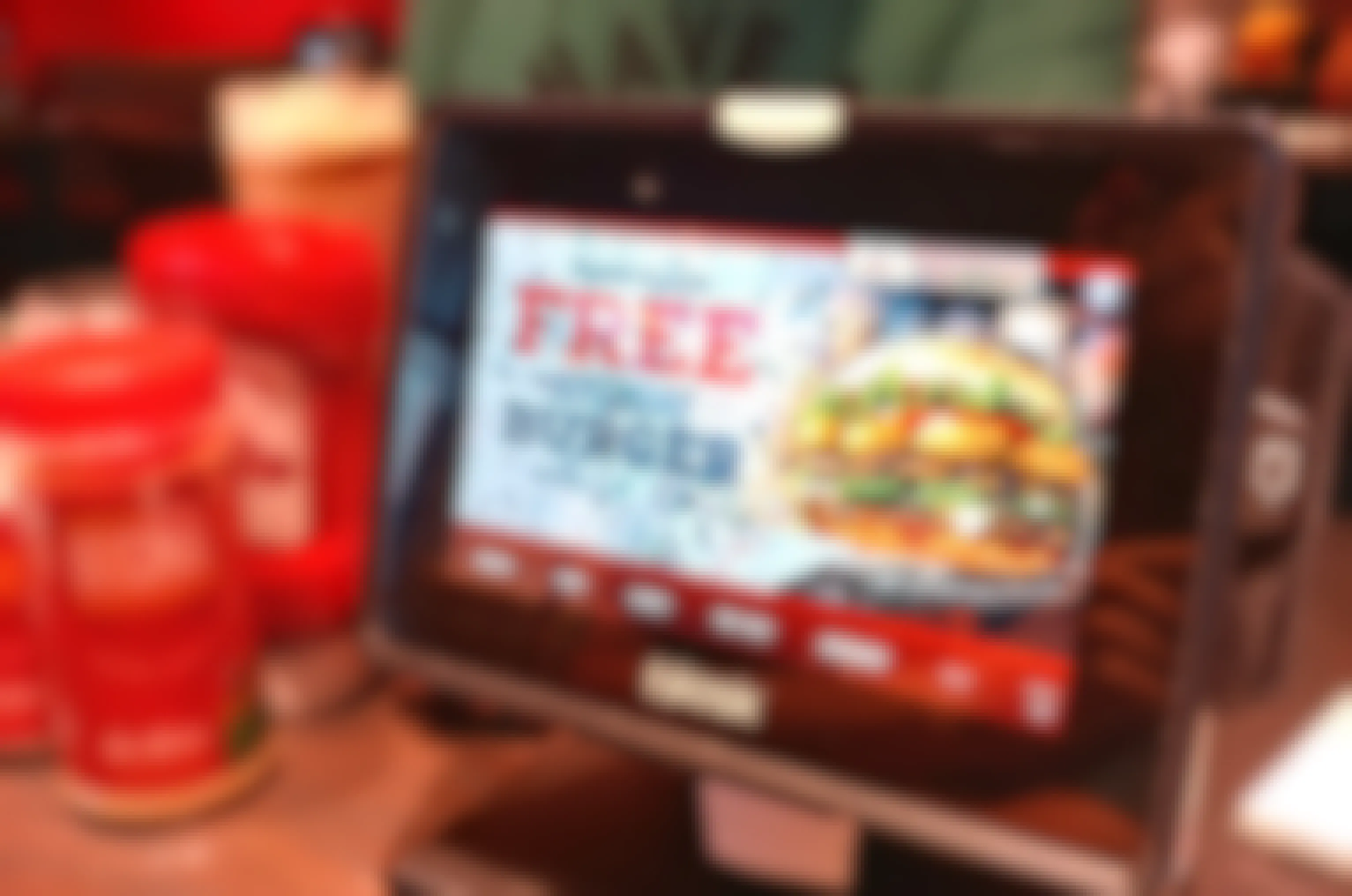 Photo of Red Robin table kiosk displaying an offer for a free birthday burger.