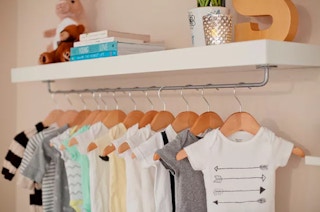 No closet? Attach a rail to the bottom of a shelf for an easy solution.