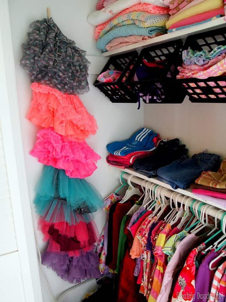 Attach clothespins to the side of a closet to store tutus and skirts.