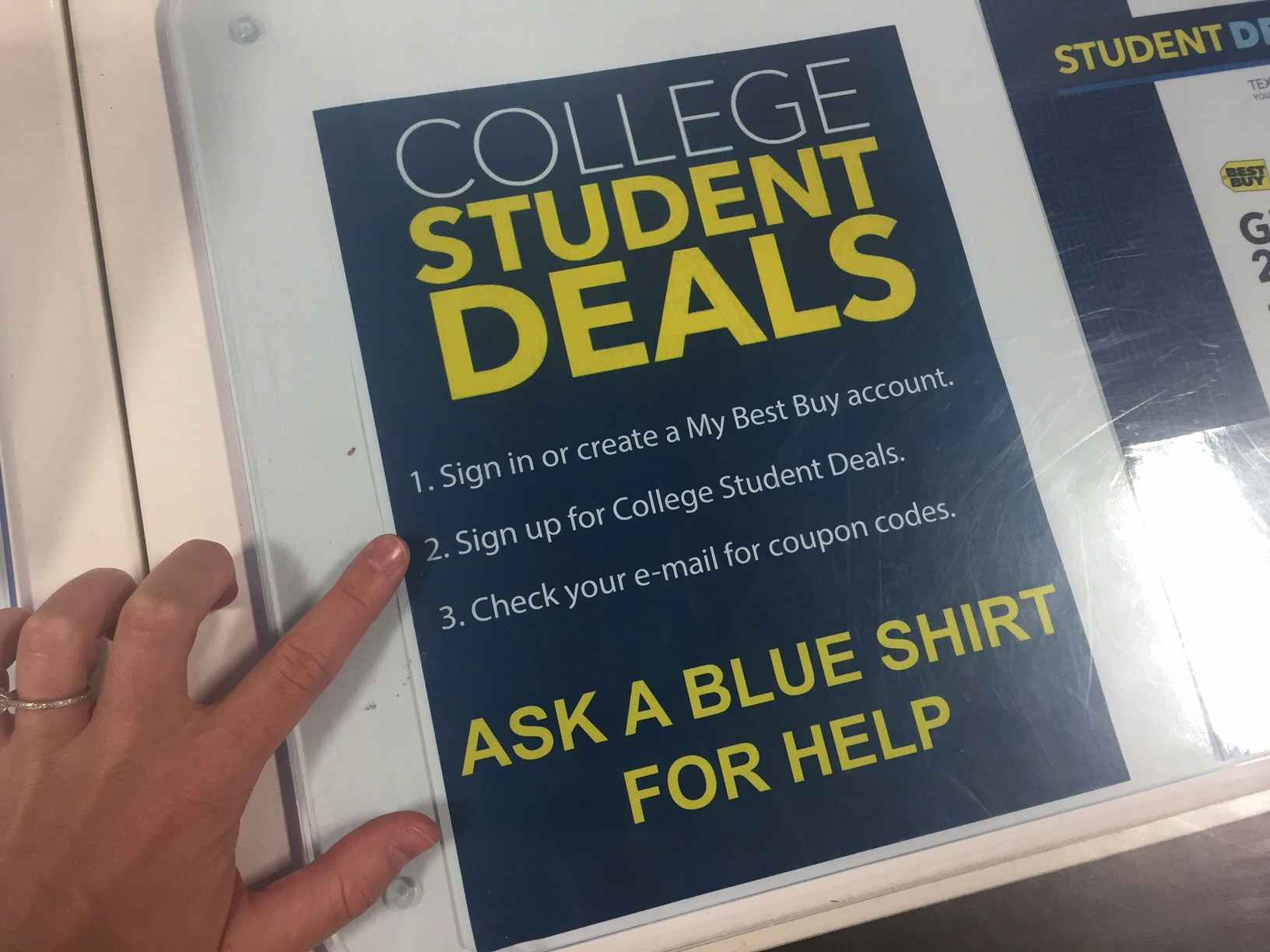 sign advertises best buy student discount program