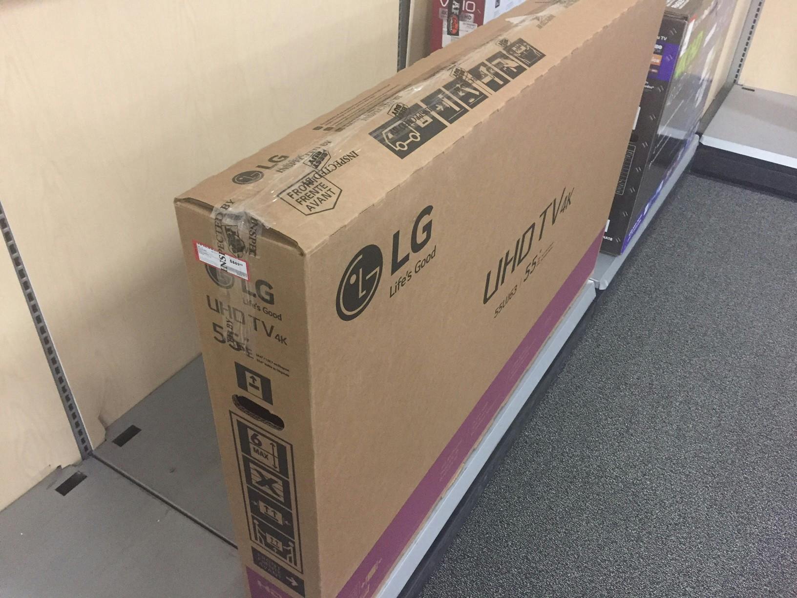 preopened box with a toshiba tv in a best buy outlet