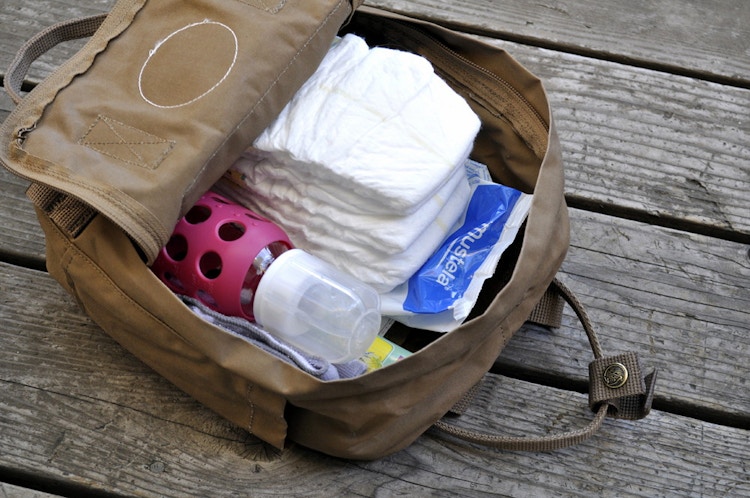 Convert a regular backpack into a diaper bag.