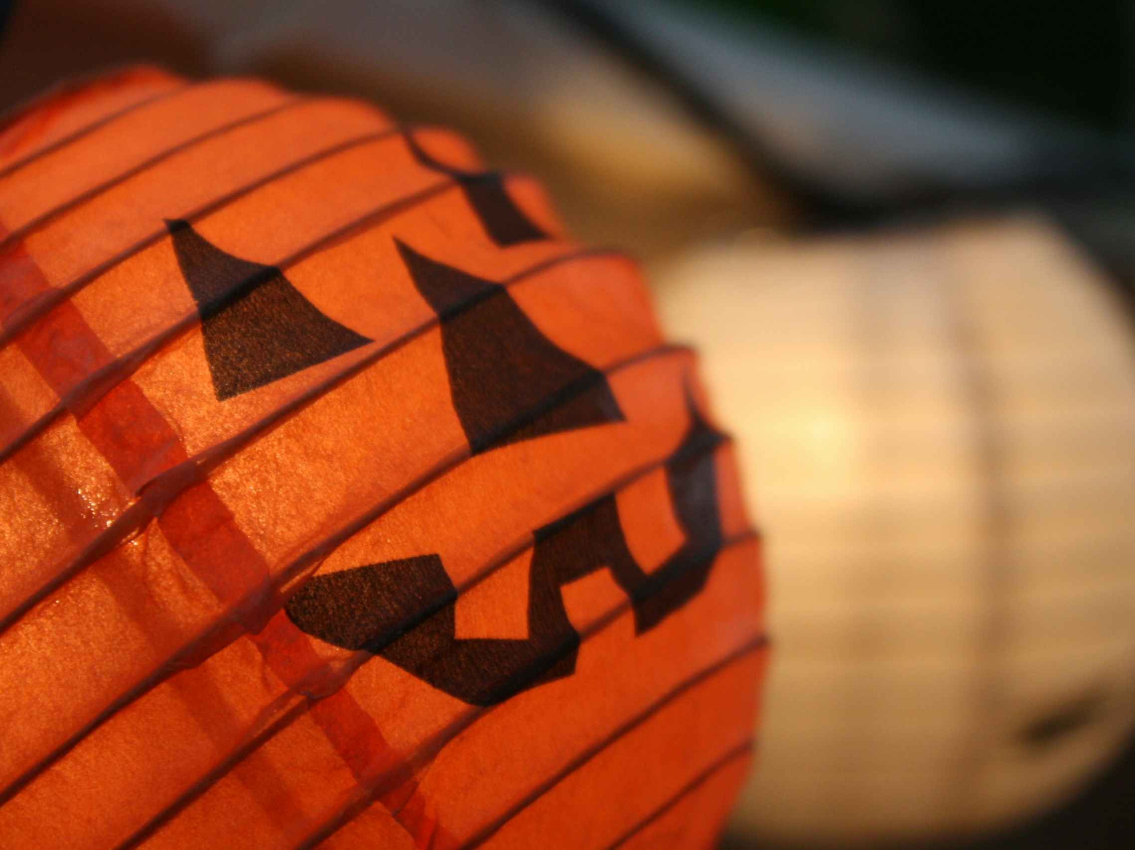 A close-up on some Halloween paper lanterns.
