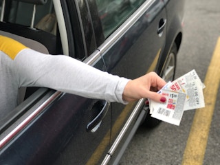 hand coupons in parking lot grocery pickup cheaper kroger fred meyer