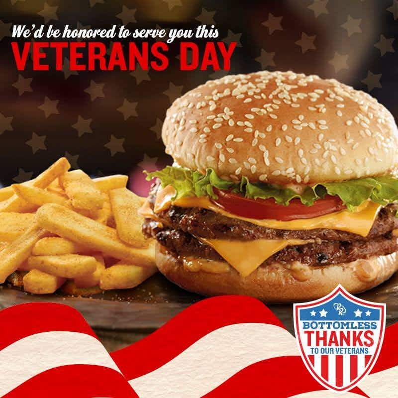 Red Robin veterans day promo featuring a burger and fries and the words "We'd be honored to serve you this Veterans Day.