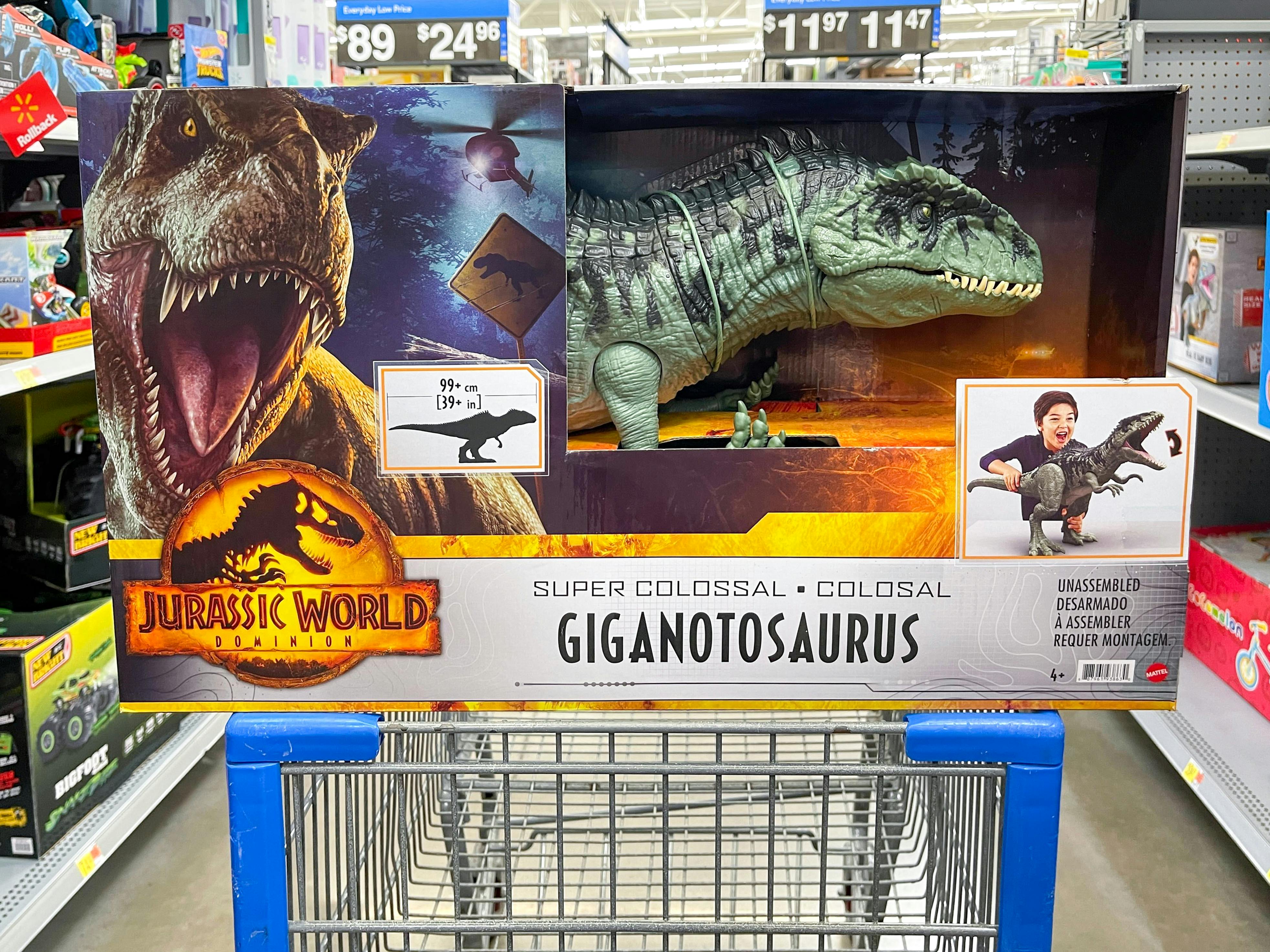 A Jurassic World Dominion Super Colossal Giganotosaurus in a Walmart shopping cart.