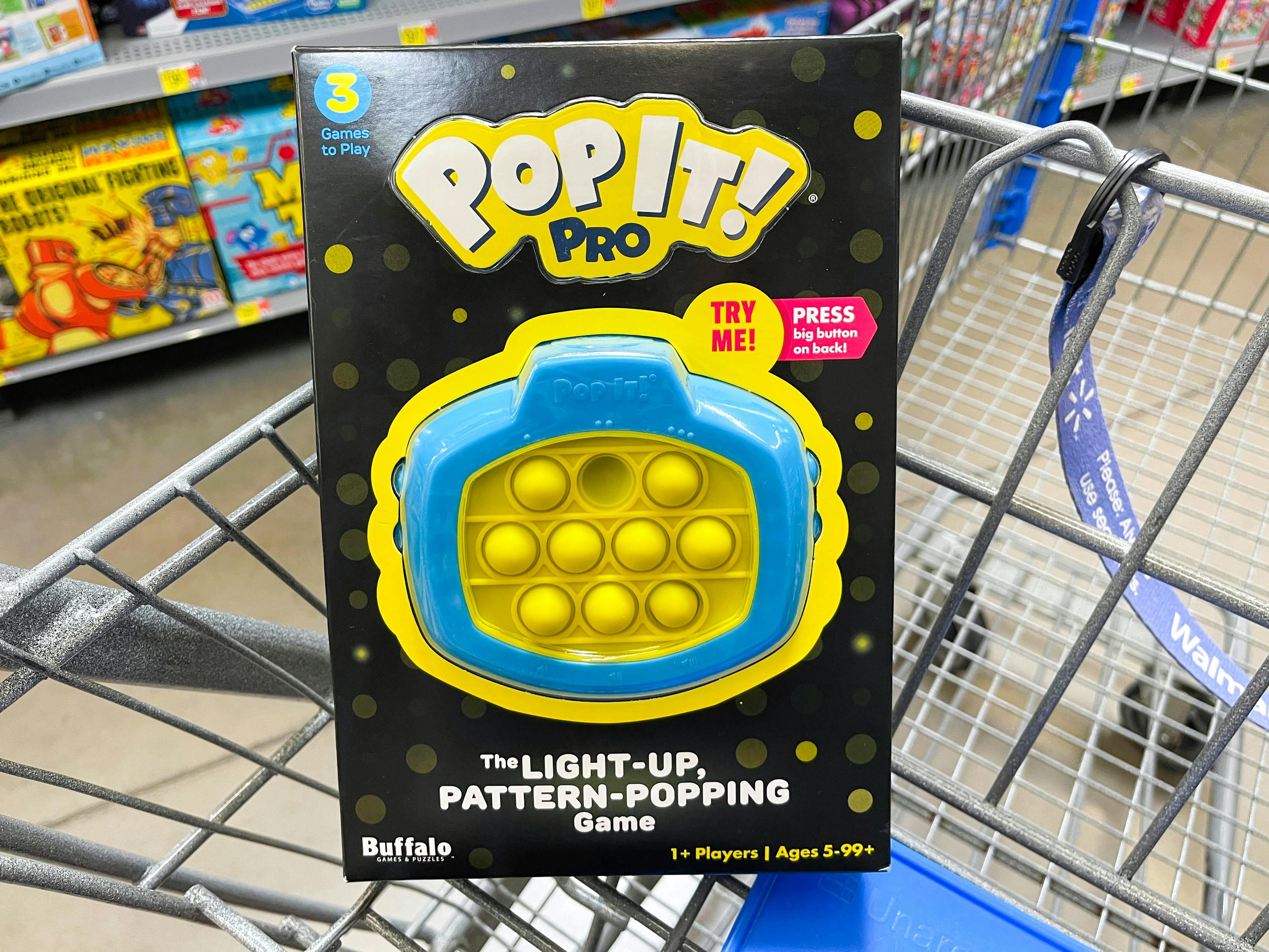 A light up Pop It Pro in a Walmart shopping cart.