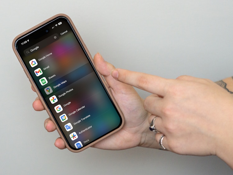 someone showing a phone about to open the Google Maps app