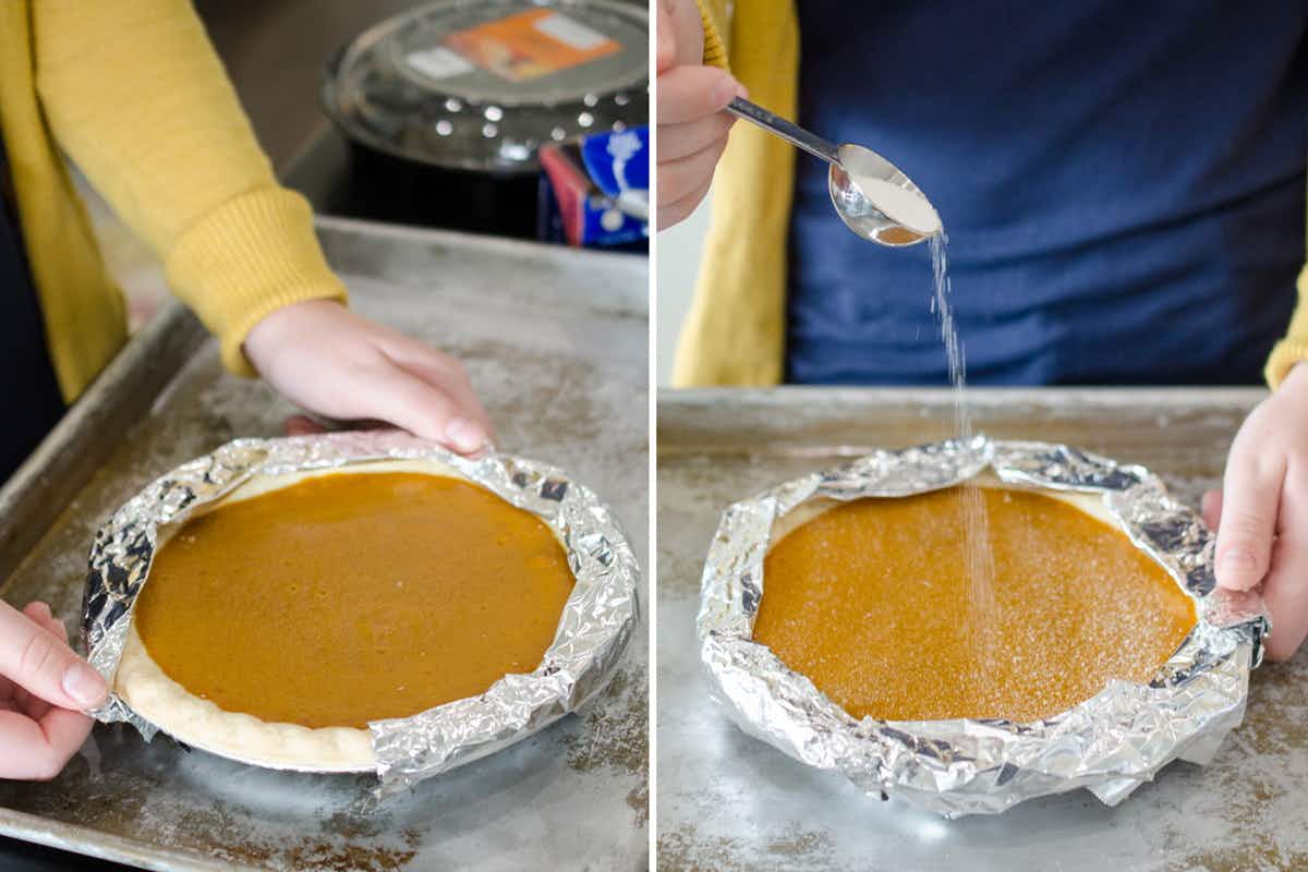 A person covering a pumpkin pie crust with foil and sprinkling a layer of sugar onto the pie.