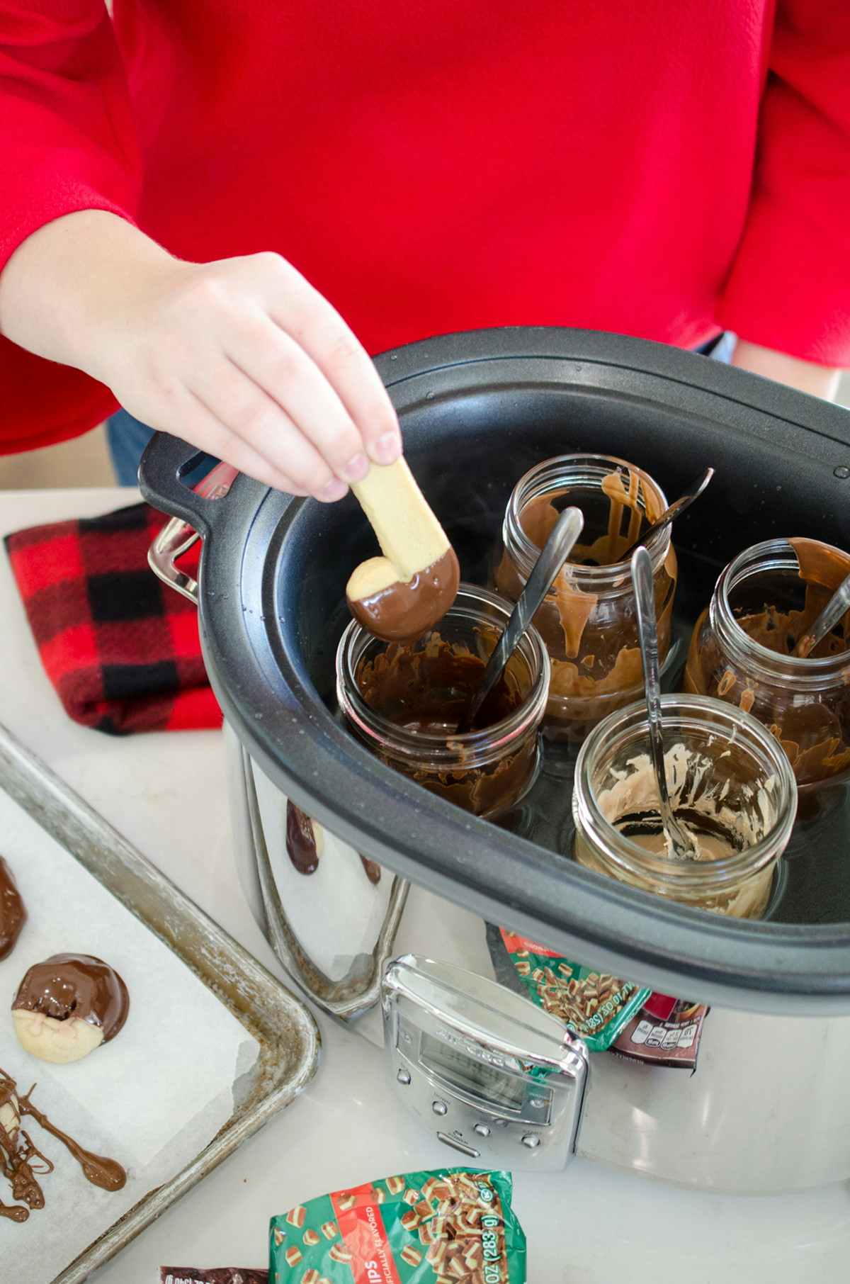 Melt chocolate and keep it melted in a slow cooker.