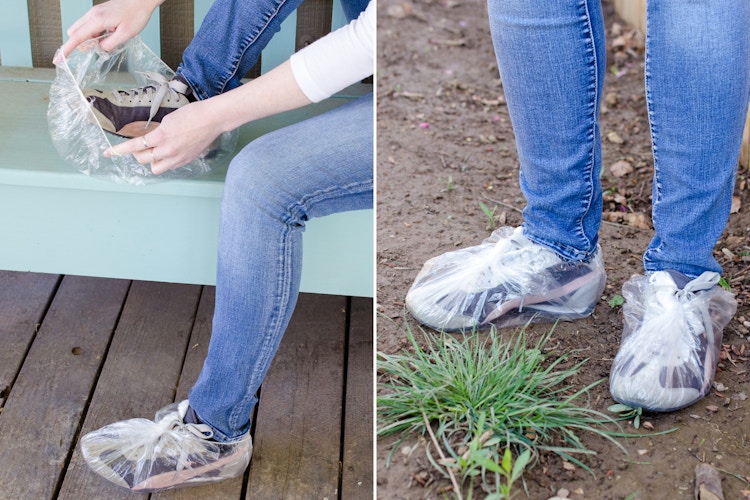 A person putting shower caps over their running shoes to protect them from mud.