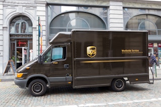 Image of a parked UPS truck in front of a store