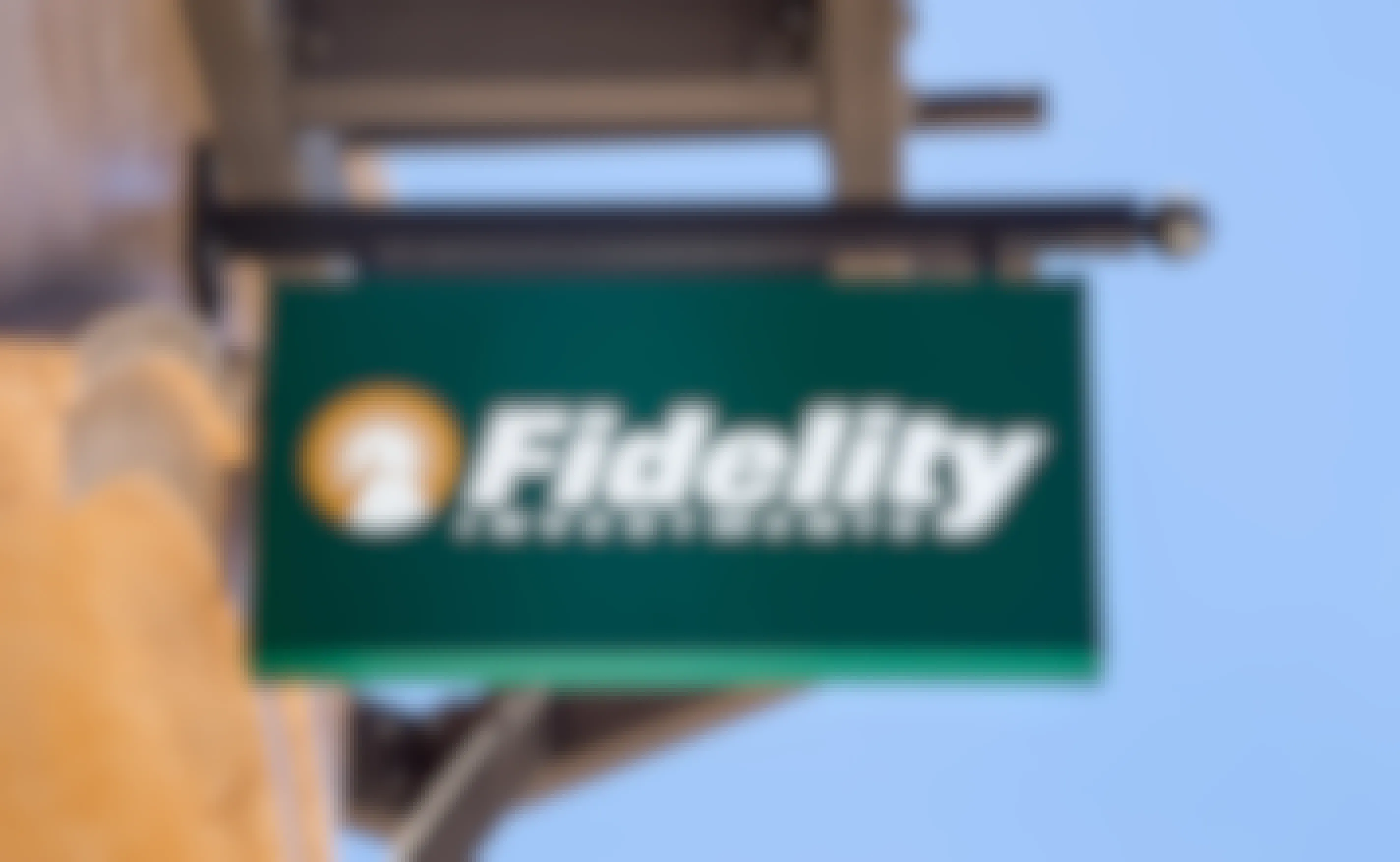 The Fidelity logo on a sign hanging against the sky