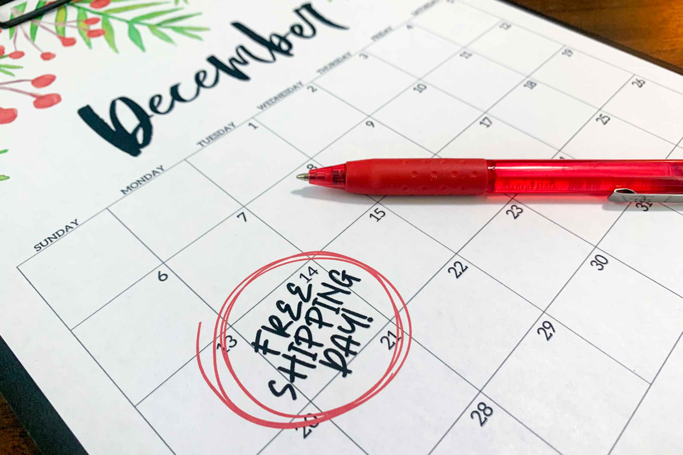 A calendar for December with "Free shipping day" written and circled on the 14th.