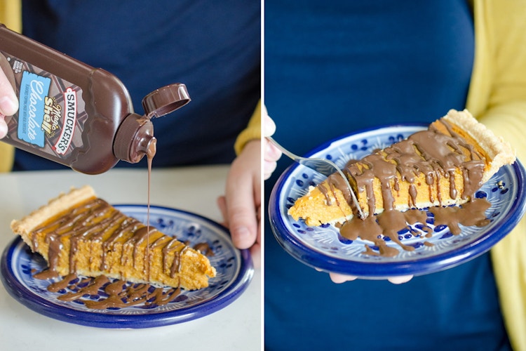 A person pouring Smucker's Magic Shell chocolate syrup onto a piece of pumpkin pie, and using a fork to cut a bite out.