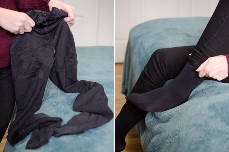 A person putting tights on under their pants