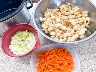 Ingredients for stuffing on the side of a slow cooker