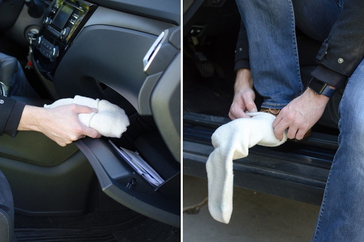 A person putting wool socks over their shoes.