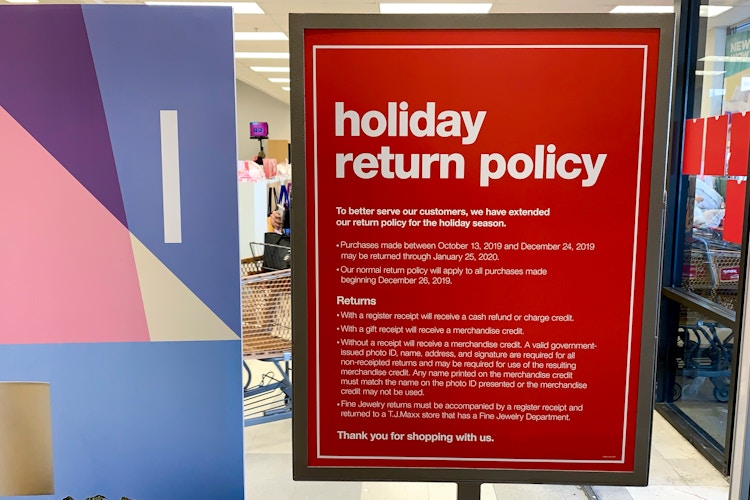 The holiday return policy sign at the front entrance.