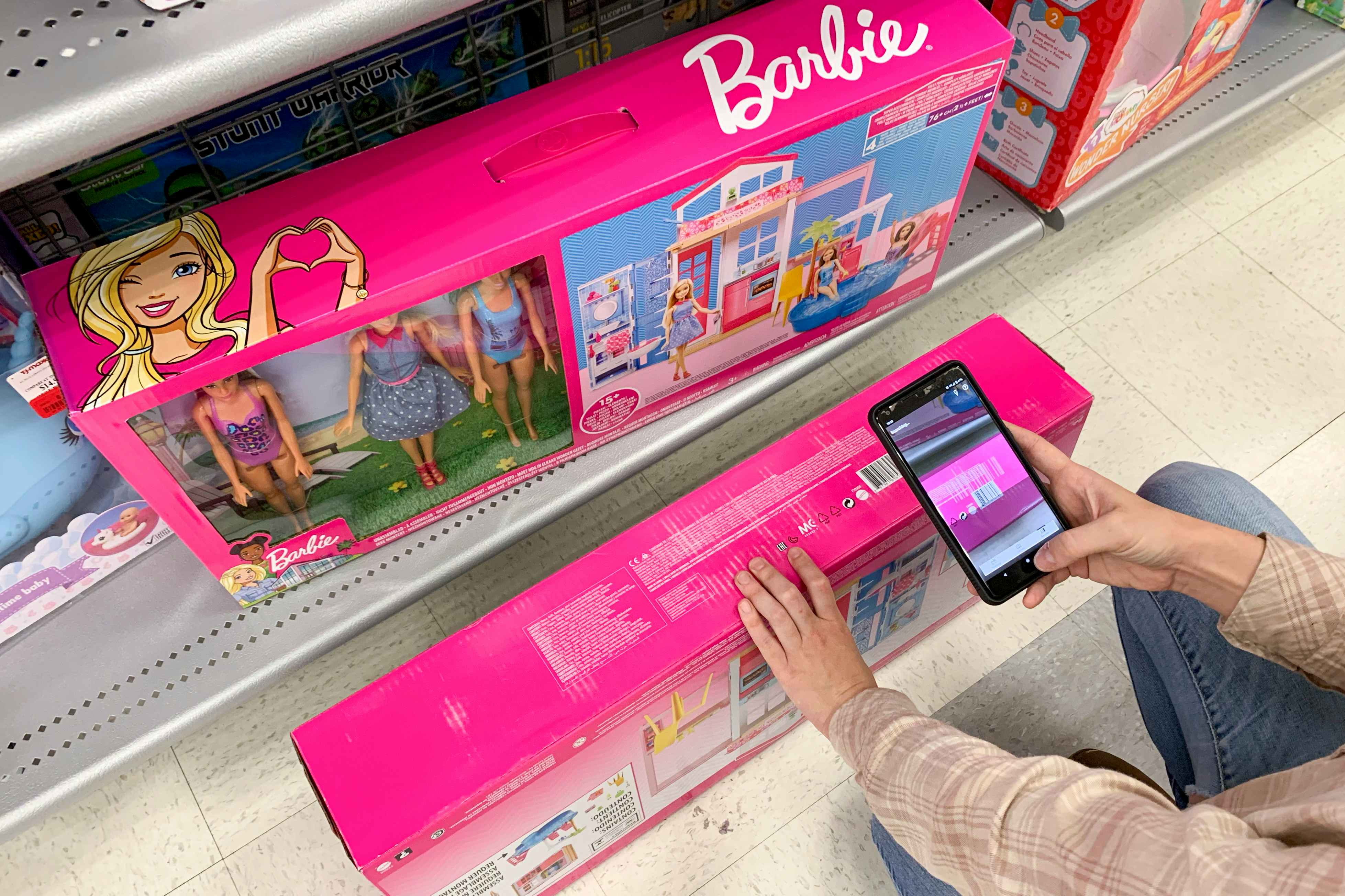 A phone with the Amazon scan price comparison, scanning a Barbie play set.