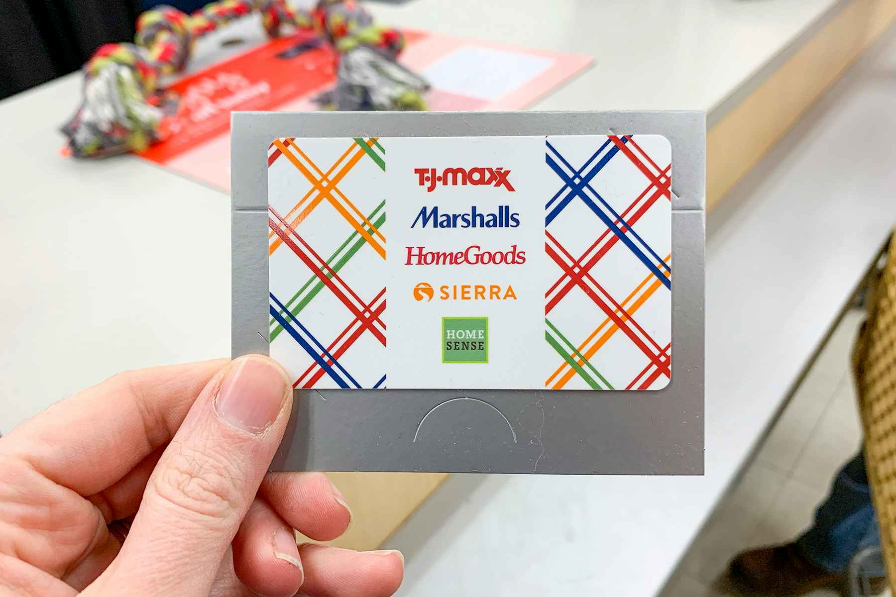 A single gift card with the stores, TJ Maxx, Marshalls, HomeGoods, Sierra, and Home Sense, printed on the front of it.