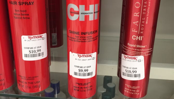 Chi Hairspray cans at T.J. Maxx with Compare At Prices zoomed in on tags