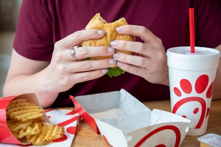 A person eating Chick fil A