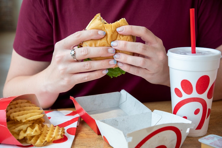 A person eating Chick fil A