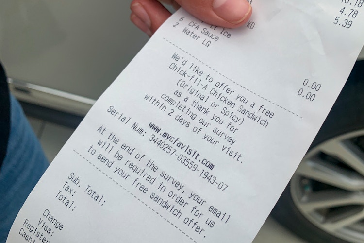 A chick-fil-a receipt with a survey for a free chicken sandwich on it.