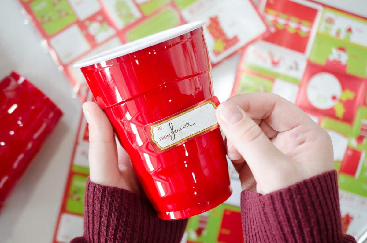 Label disposable cups with gift tags.