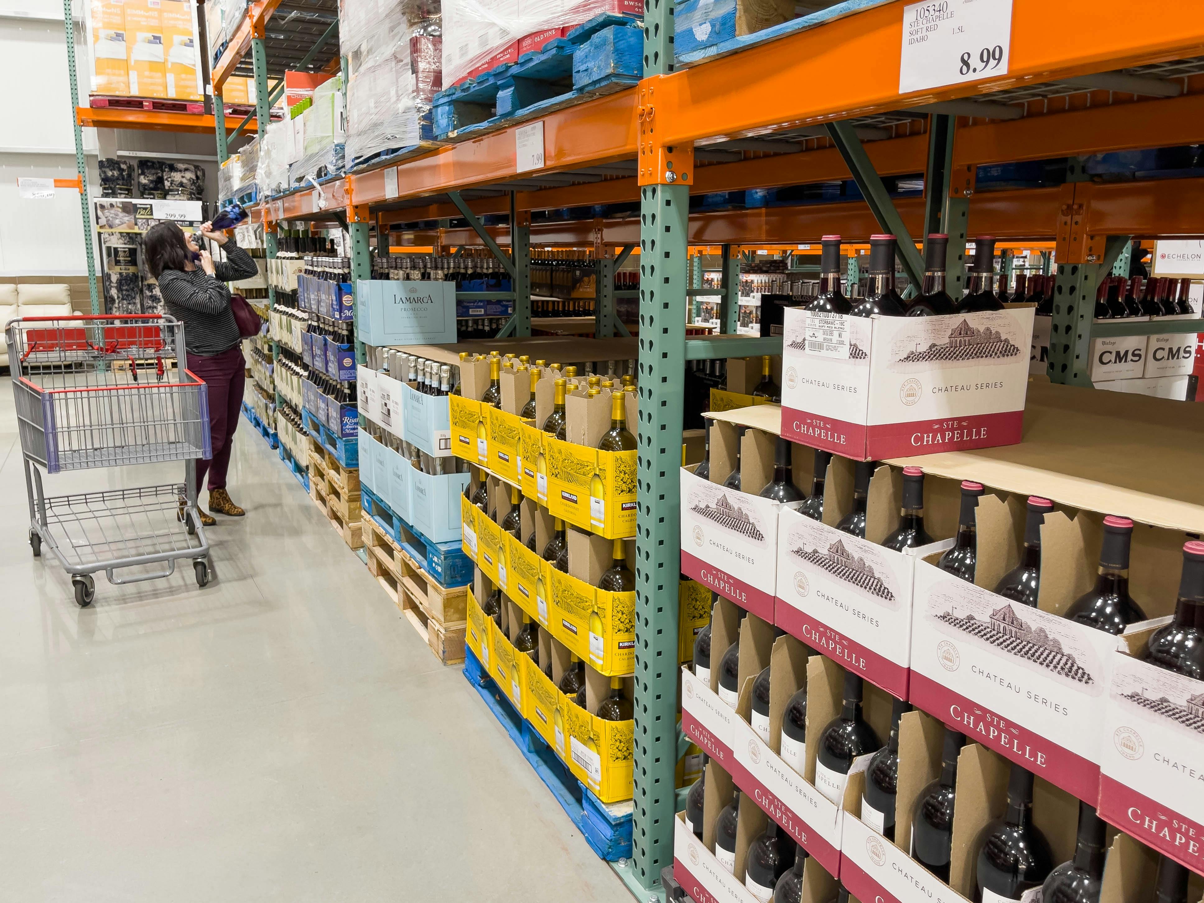 A person shopping for wine inside Costco