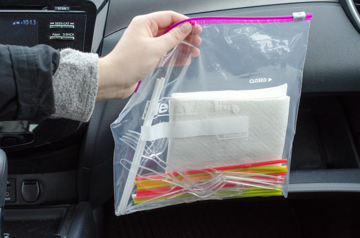 Keep extra plastic utensils, napkins and straws in your glove compartment.