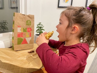 child eating panera kids meal at home