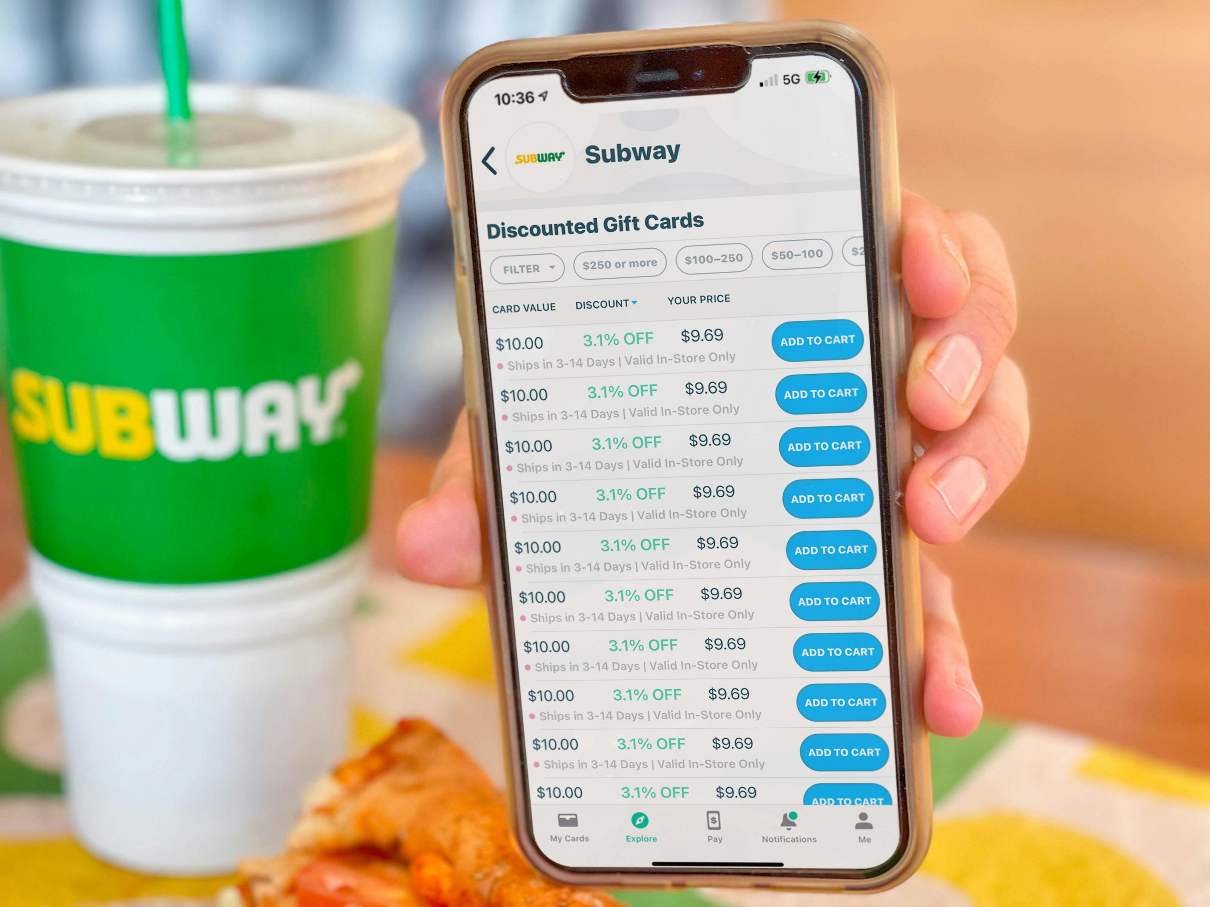 raise app on cellphone next to subway cup