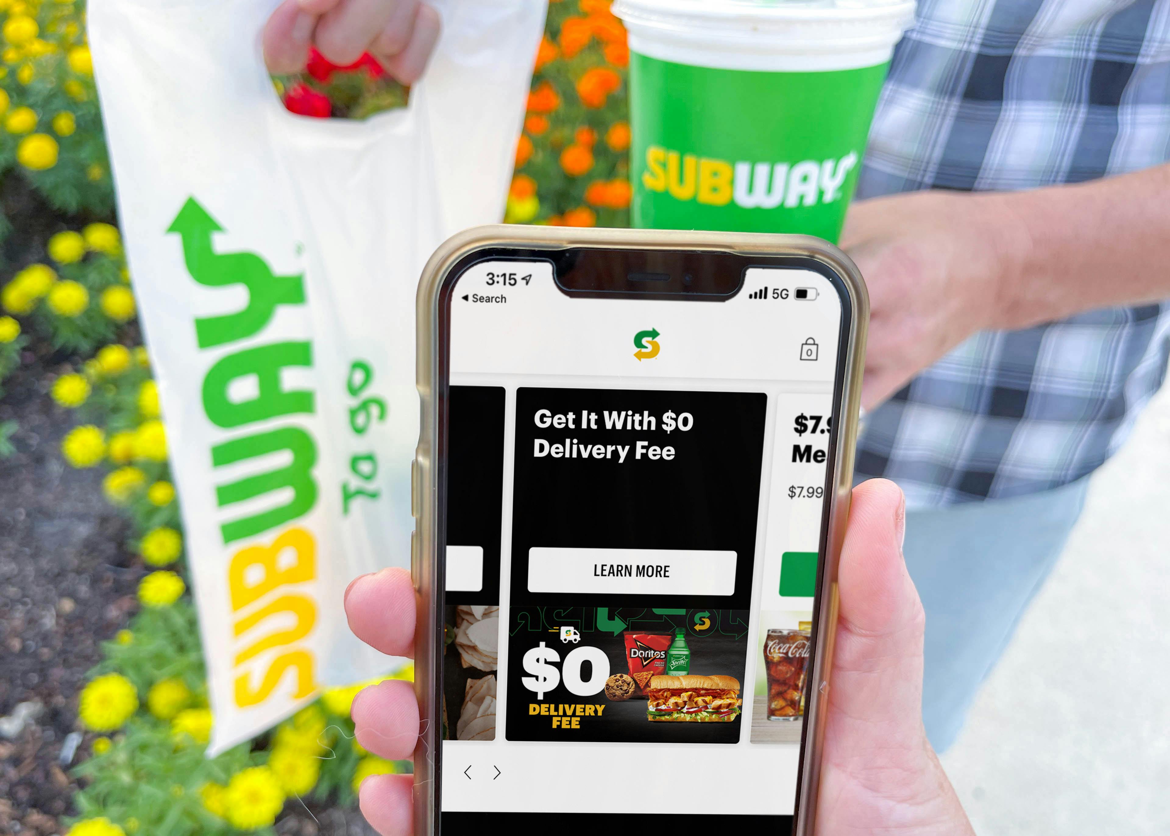 subway app with deals on cellphone next to subway bag