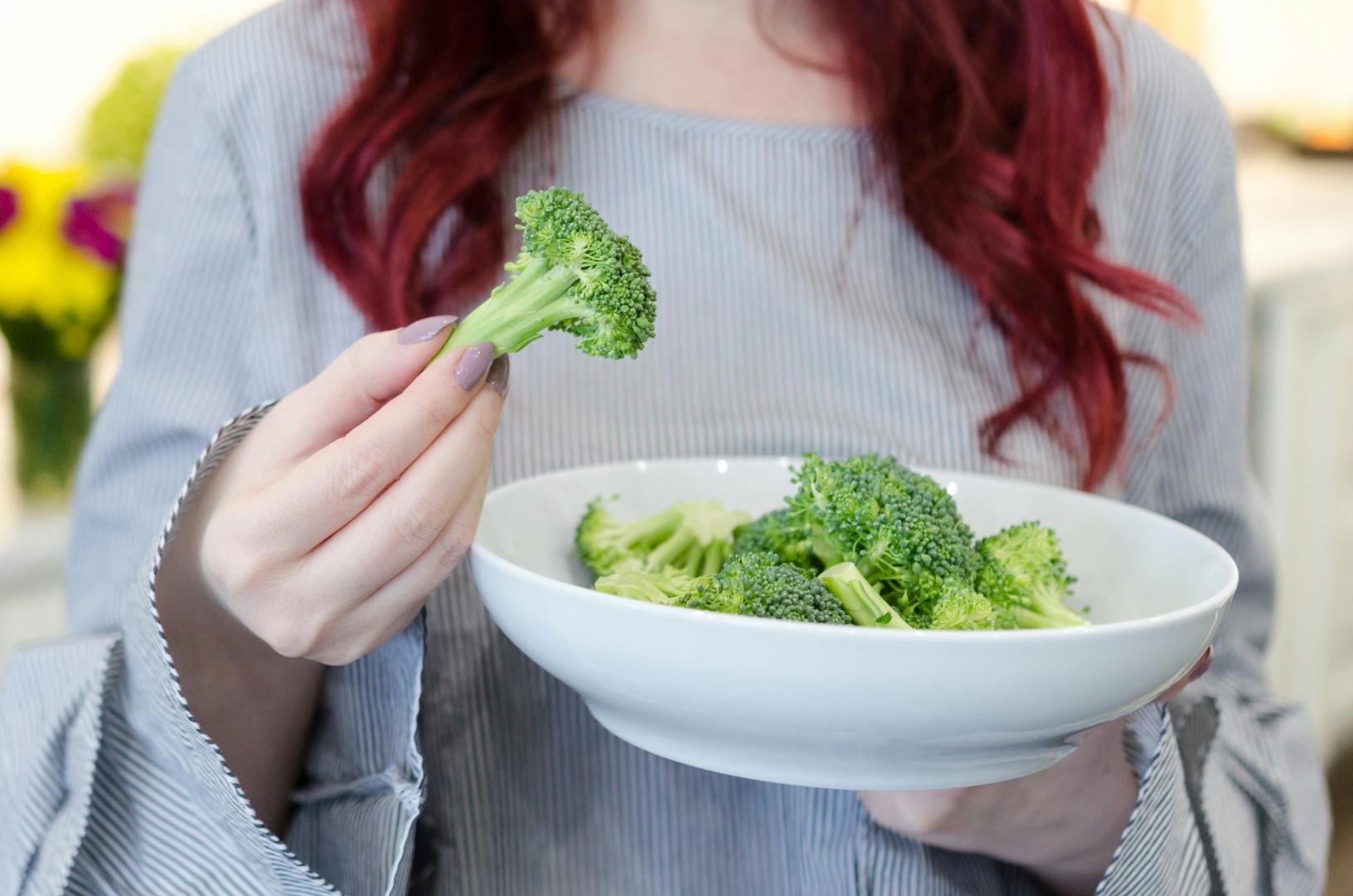 Before you go out to dinner or a party, eat two cups of raw vegetables to avoid overeating unhealthy food.
